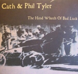 Cath & Phil Tyler - Hind Wheels Of Bad Luck in der Gruppe Övrigt /  bei Bengans Skivbutik AB (4142668)